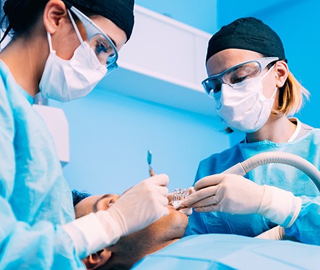 Dentists performing surgery