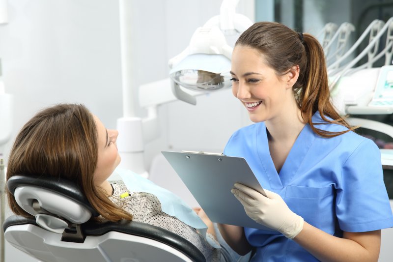 patient asking dentist about pros and cons of CEREC crowns