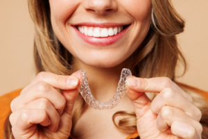 Close up of woman inserting Candid Pro Clear Aligners